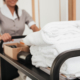 Hotel worker pushing cart