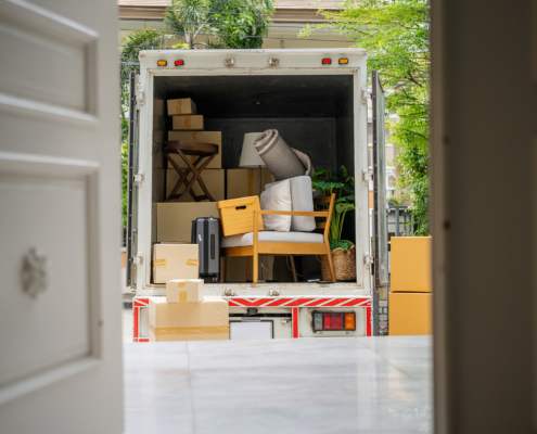 Back of moving truck loaded with furniture